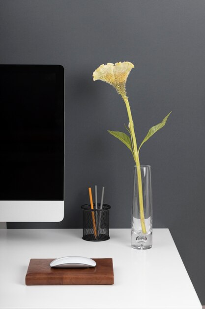 Business desk concept with flower