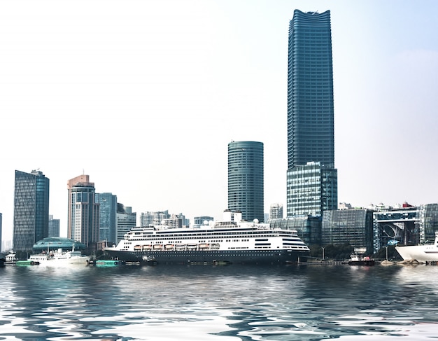 Business district cityscape from a park with blue sky