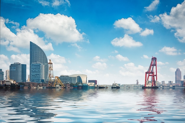 Business district cityscape from a park with blue sky