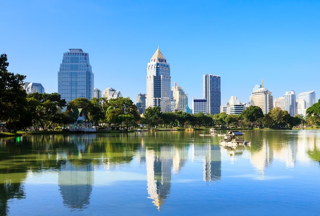 Business district cityscape from a park with blue sky