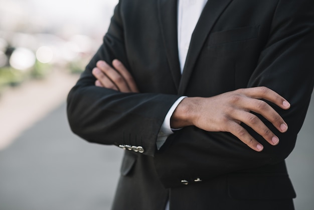 Free photo business employee with arms crossed