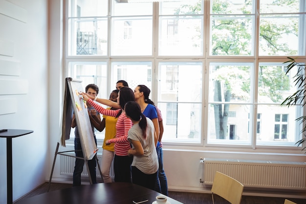 Business executive discussing on whiteboard