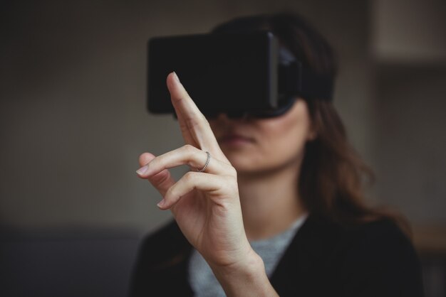 Business executive using virtual reality headset