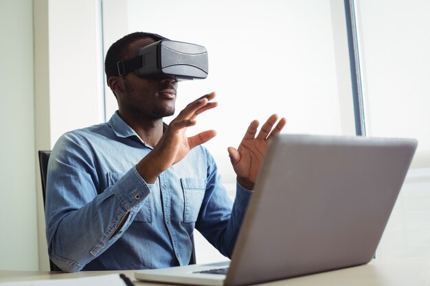 Business executive using virtual reality headset