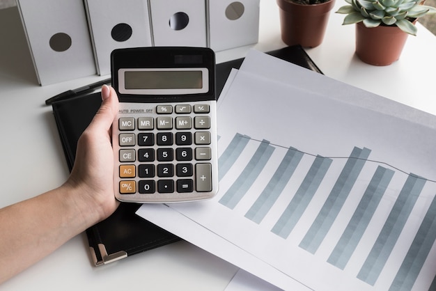 Business female holding calculator