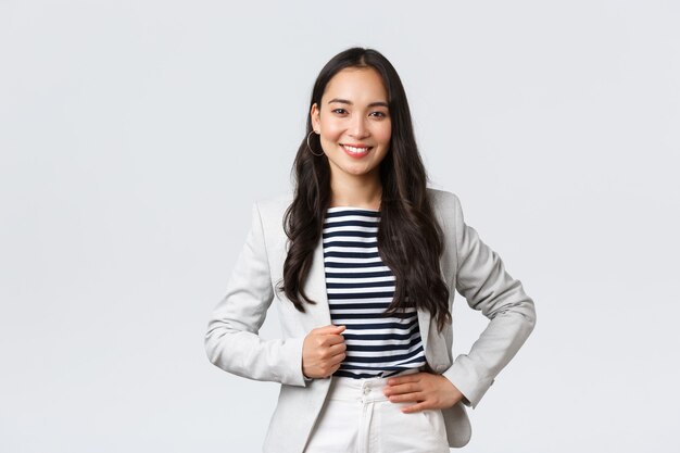 Business, finance and employment, female successful entrepreneurs concept. Confident good-looking female office manager, lady in white jacket smiling and looking determined to win case in court.