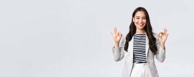 Free Photo business finance and employment female successful entrepreneurs concept friendlylooking professional smiling businesswoman guarantee best quality or good deal show okay gesture no problem
