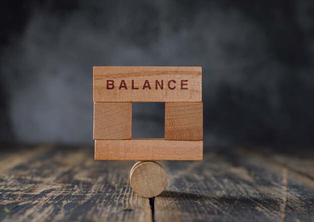 Business and financial accounting concept with wooden blocks side view.