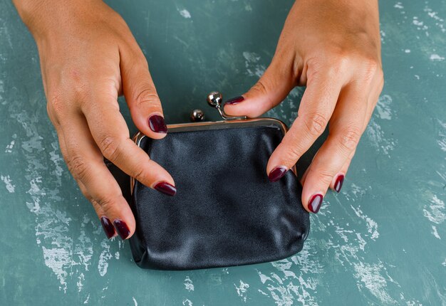 Business and financial concept. woman opening coin purse.