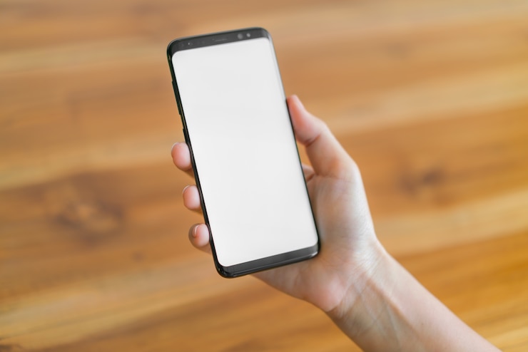 Free Photo business hand with mobile phone .