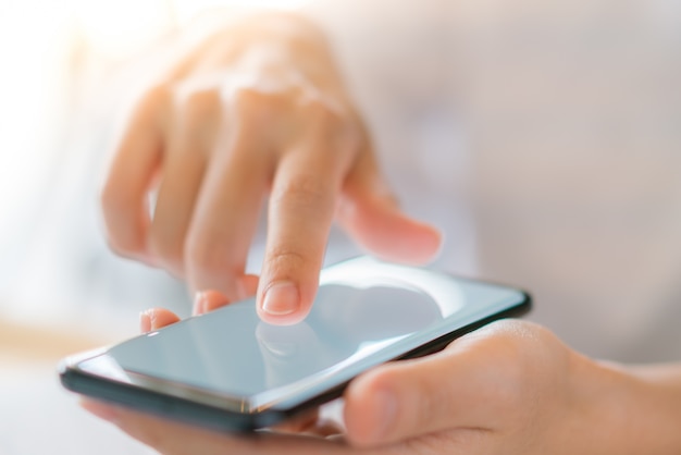 Business hand with mobile phone .