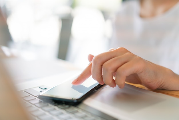 Business hand with mobile phone .