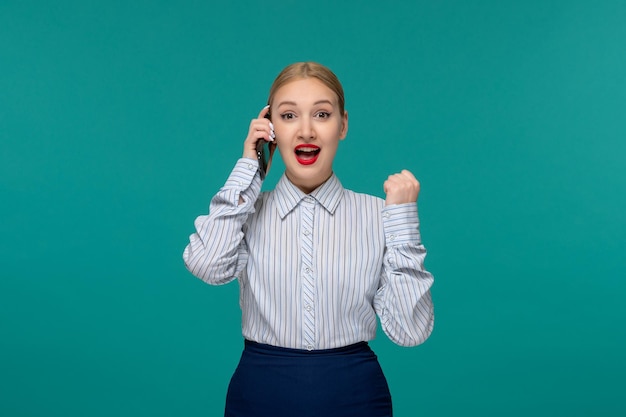 Business lady excited pretty blonde woman in office outfit on the phone