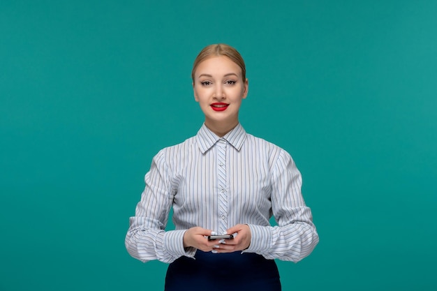 Business lady pretty blonde woman in office outfit smiling with the phone in hands