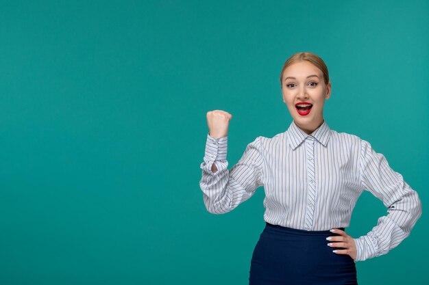 Business lady young girl in office outfit excited holding fist up