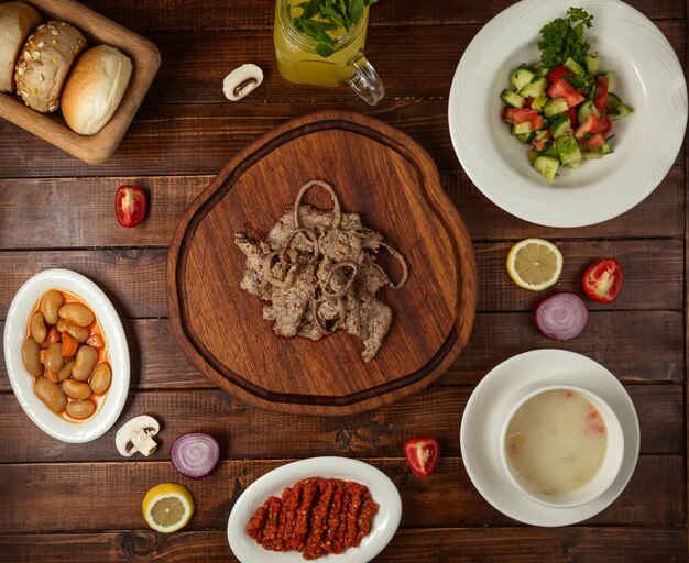 Business lunch with soup salad and meat dish