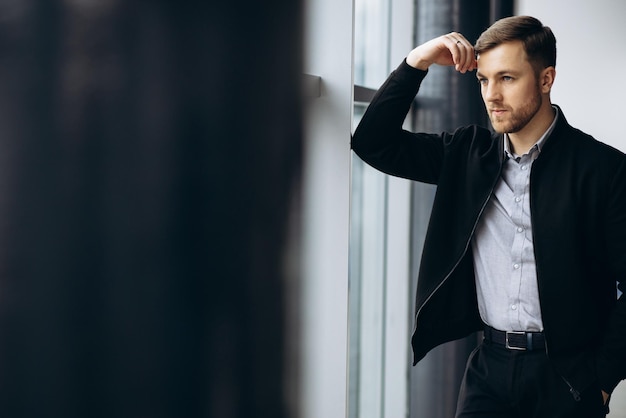 Business man choosing a car in car salon