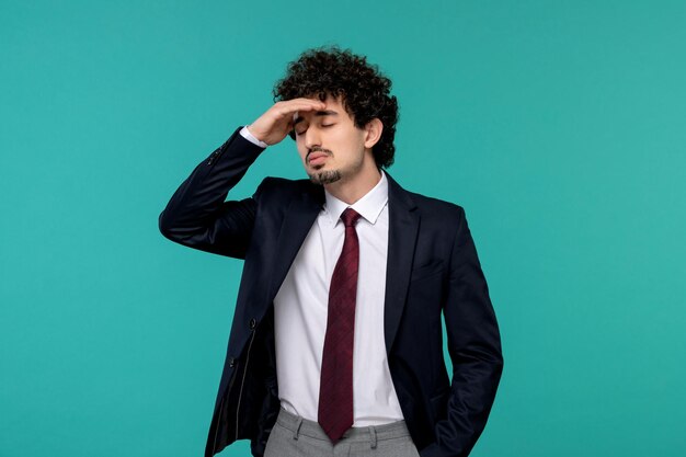 Business man curly cute handsome guy in black suit thinking and tired with closed eyes