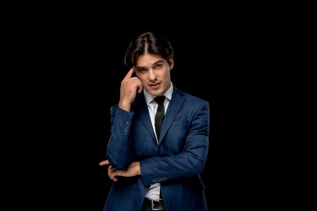 Business man cute brunette man in dark blue suit standing confused