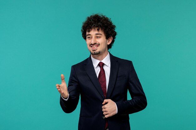 Business man cute pretty guy in black office outfit giving a handshake and smiling