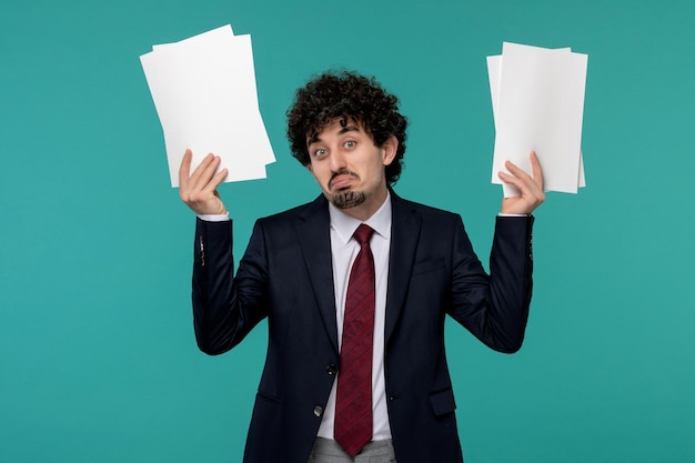 Free photo business man cute pretty guy in black office outfit holding paper sheets