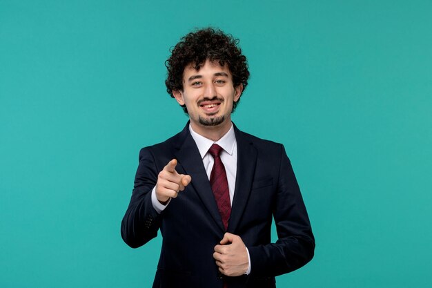 Business man cute pretty guy in black office outfit smiling and pointing front