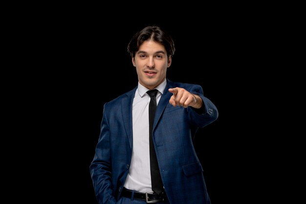 Business man cute young man in dark blue suit pointing front