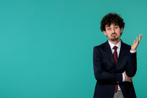 Free photo business man handsome cute young guy in black suit and red tie confused and waving hands