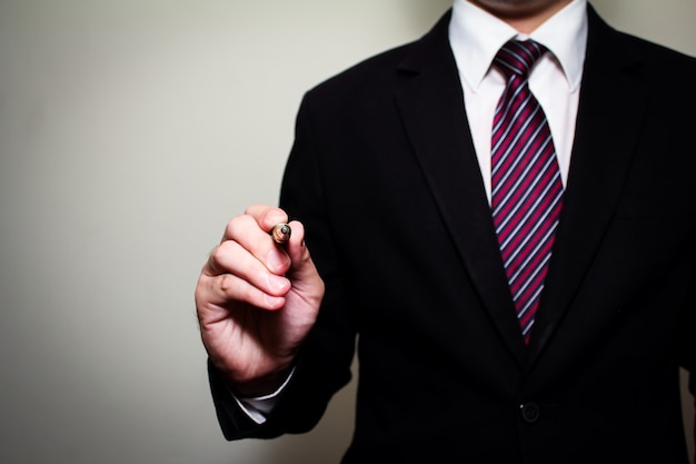 Business man holding fountain pen