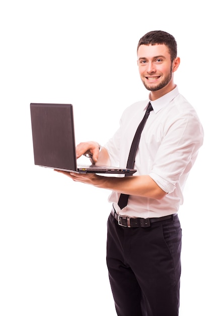 Business man holding a laptop - isolated over a white wall