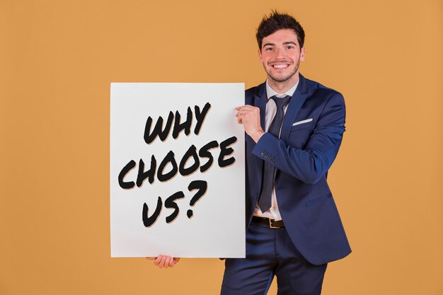 Business man holding a paper with the why choose us question