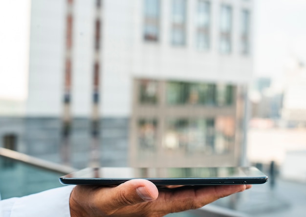 Business man holding tablet in hand