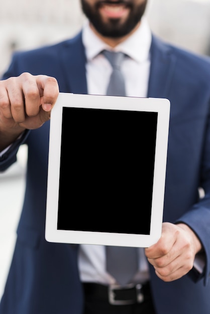 Business man holding tablet