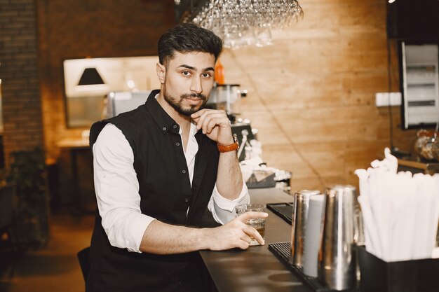 Business man in a pub, drinking water