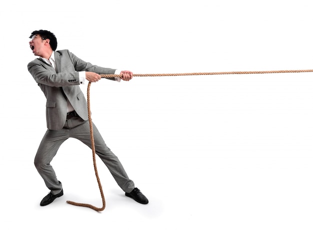 Business man pulling on a rope