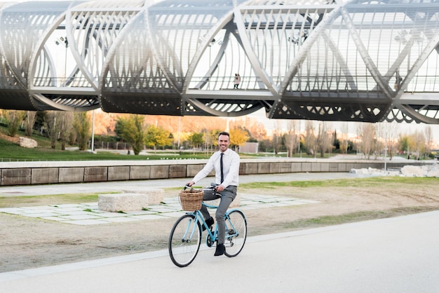 Business man riding a vintage bicycle in the cityxA