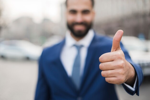 Business man showing ok sign