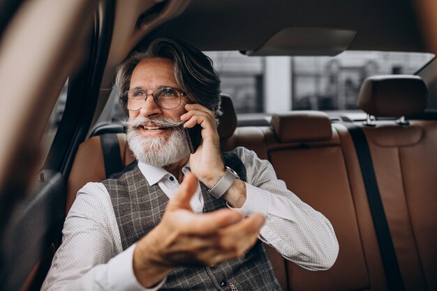 Business man sitting in his car at the back sit