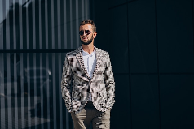 Business man standing outside the street