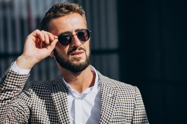 Business man standing outside the street