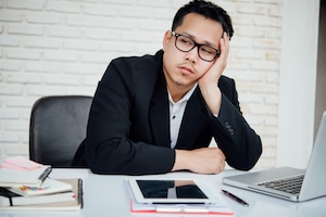 Business man unhappy businesspeople sitting in office