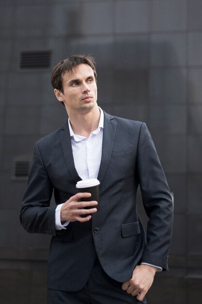 Business man with coffee on break