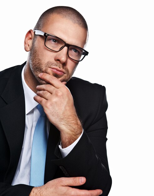 Business man with glases at the table isolated white