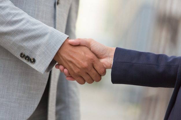 Business man and woman greeting each other