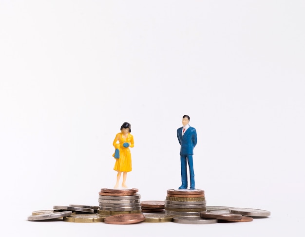 Free photo business man and woman sitting on coins