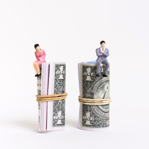 Free photo business man and woman sitting on money