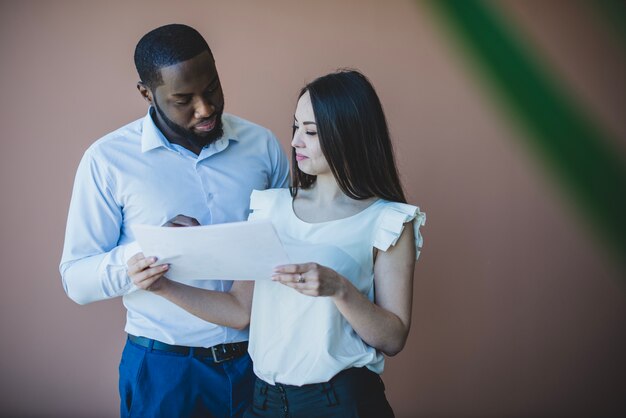 Business man and woman with paper