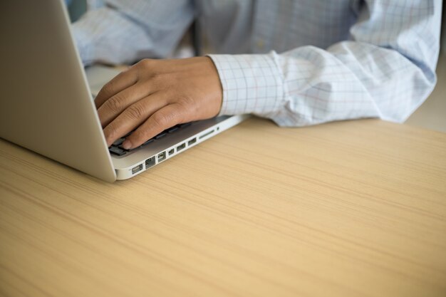 business man working on the laptop at office with copyspace