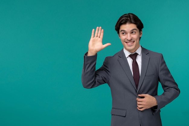 Business man young cute handsome man in grey office suit and tie saying hello