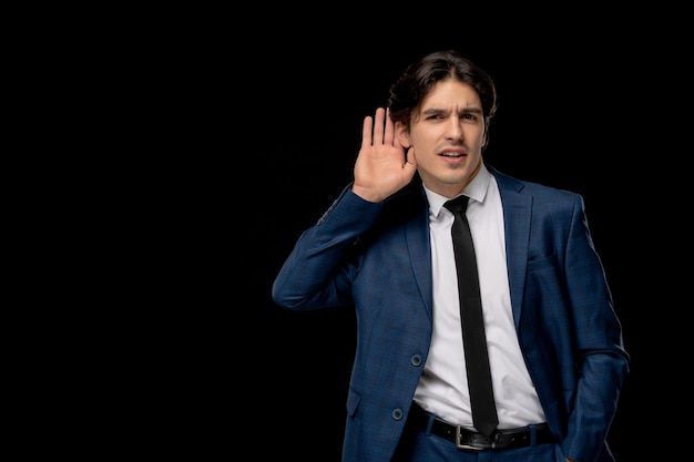 Business man young cute man in dark blue suit with the tie eavesdropping